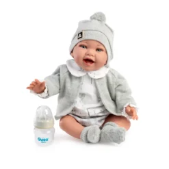 Muñecas Guca Bebé con Peso Zuri con Camisa, Braguita, Chaqueta, Gorro de Lana, Biberón y Calcetines